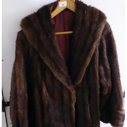 24 - A vintage two tone, three-quarter length fur jacket