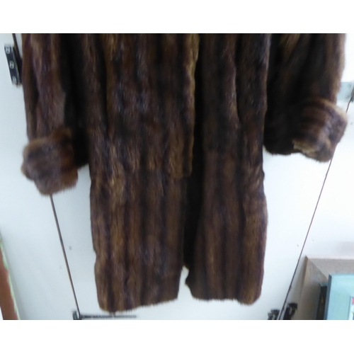 24 - A vintage two tone, three-quarter length fur jacket