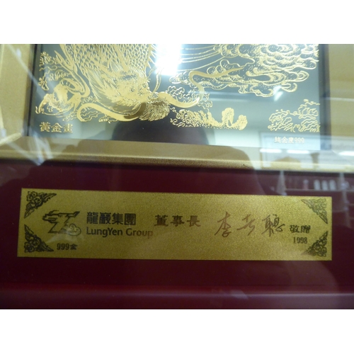 245 - A modern Chinese gilded artwork, stamped 999 and LungYeh Group 1998, featuring a mythical figure&nbs... 