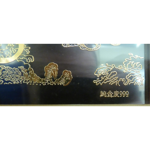 245 - A modern Chinese gilded artwork, stamped 999 and LungYeh Group 1998, featuring a mythical figure&nbs... 