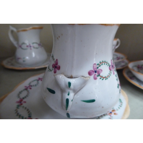 248 - A late Victorian porcelain tea set, hand painted with floral designs and orange banding  compri... 