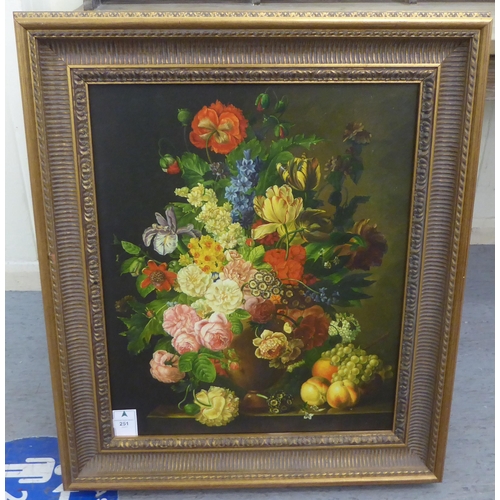 251 - 20thC Continental School - a still life study, mixed flowers, in a vase, on a ledge  oil on can... 