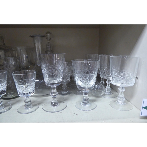 255 - Glassware: to include pedestal wines; a decanter; a cordial jug; and five glasses