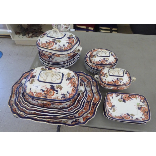 259 - Late Victorian Wedgwood china tableware, decorated in a version of the Imari pallete with gilt bandi... 