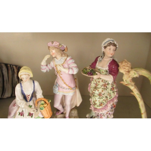 260 - Four late 19th/early 20thC European porcelain figures: to include a woman playing a harp (no string ... 