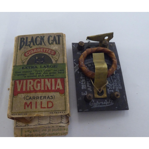 265 - A vintage cigarette box radio panel  boxed with instructions; and a cast metal lion ornament 2