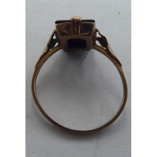 270 - A Bulova gold coloured metal ring, set with a black tablet and initial 'B'