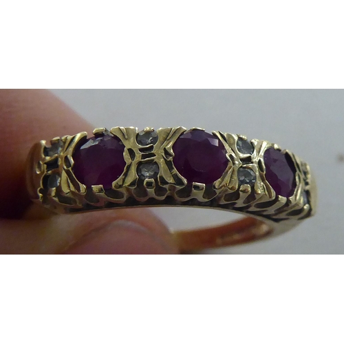 274 - A 9ct gold ring, set with alternating diamonds and rubies