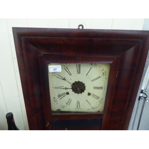 37 - A late Victorian American mahogany veneered cased wall clock; the 30hr movement faced by a painted R... 