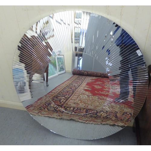 5 - A modern unframed mirror with a multi-sectional plate  40