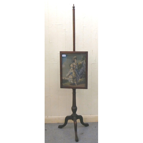 53 - A 1930s oak polescreen, set with a tapesrty panel, raised on a tripod base  56