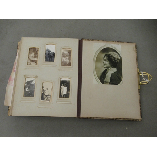 67 - A late Victorian photograph album, containing family groups