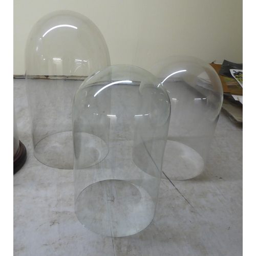 82 - Five glass display domes: to include a pair  12.5