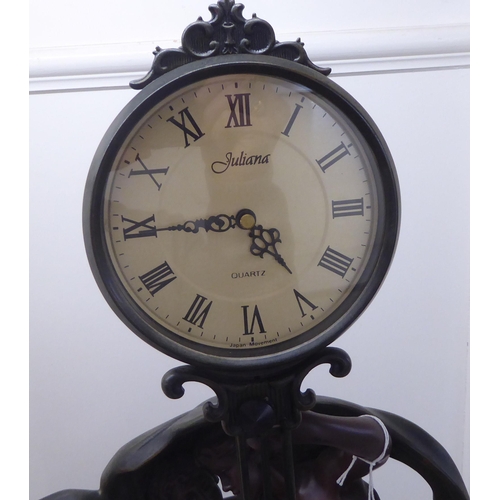57 - A modern reproduction of a 19thC Continentally inspired timepiece, featuring two classical dancing f... 