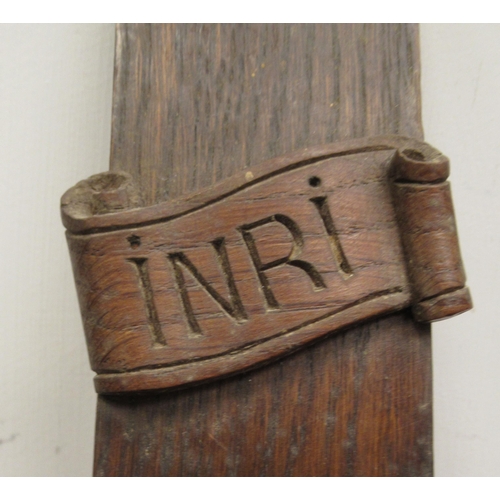 9 - A late 19thC carved oak crucifix, a banner on the cross, inscribed 'RNRI' and inscribed L Verbeke&nb... 