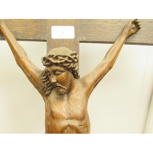 9 - A late 19thC carved oak crucifix, a banner on the cross, inscribed 'RNRI' and inscribed L Verbeke&nb... 