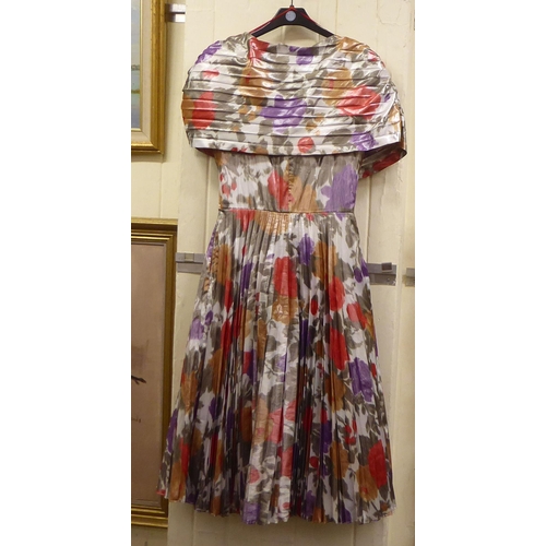 14 - A Frank Usher three-quarter length dress with a pleated skirt in bright colours  UK size 34