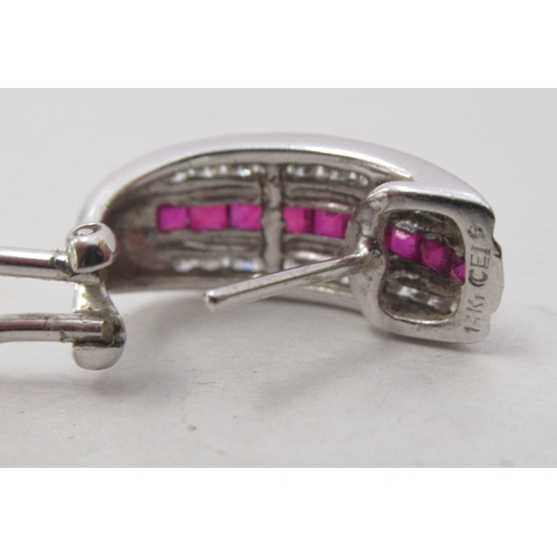 324 - A pair of 14k white gold, ruby and diamond set earrings
