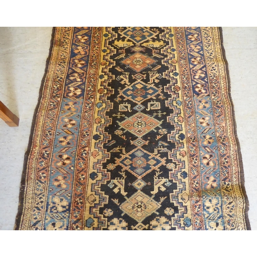 43 - A Persian runner, on a multi-coloured ground  41