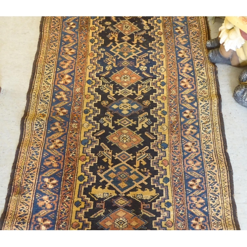 43 - A Persian runner, on a multi-coloured ground  41