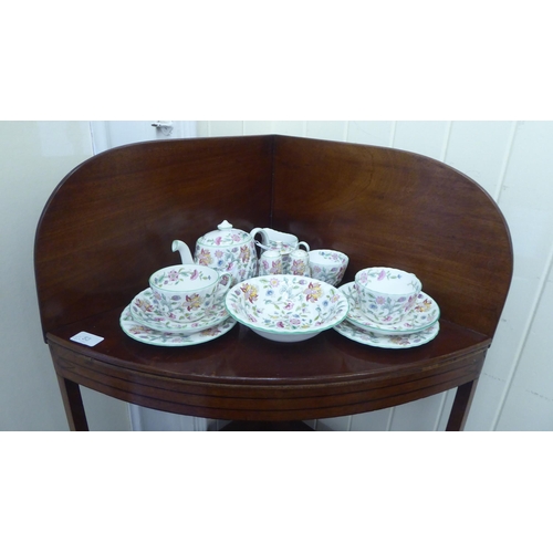 53 - A George III mahogany two tier quadrant washstand, raised on splayed legs  40