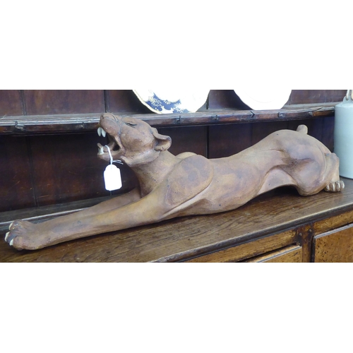 55 - Susie Marsh - a rust coloured stone model, a Jaguar  bears a signature & dated 1988  29