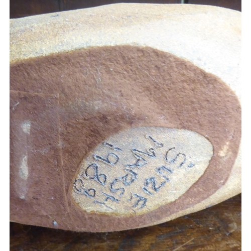 55 - Susie Marsh - a rust coloured stone model, a Jaguar  bears a signature & dated 1988  29
