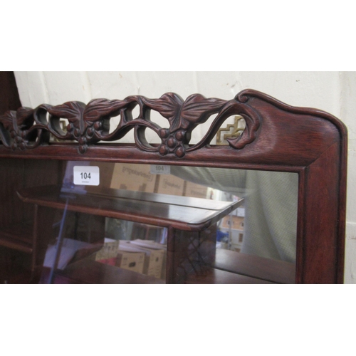 104 - A modern Japanese rosewood netsuke cabinet with a glazed door, enclosing tiered shelves  32