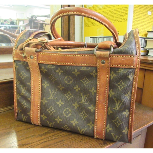 107 - A Louis Vuitton make-up bag with stitched brown hide handles