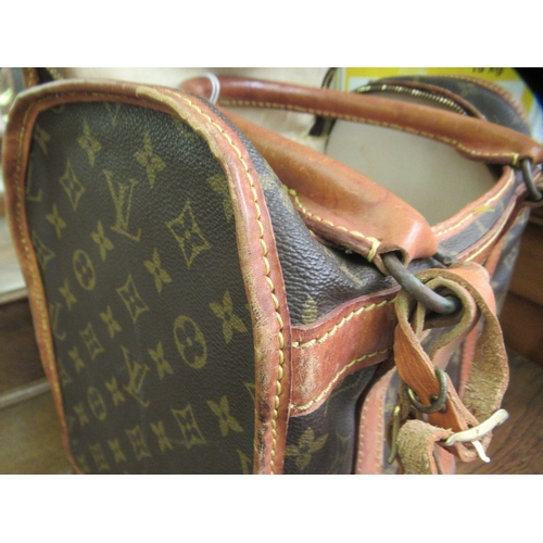 107 - A Louis Vuitton make-up bag with stitched brown hide handles