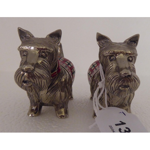 137 - A pair of part enamelled novelty condiments pots, fashioned as Scottie dogs