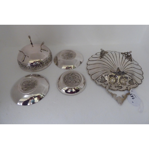 141 - Five items of Continental silver coloured metal, viz. a shell design dish  8