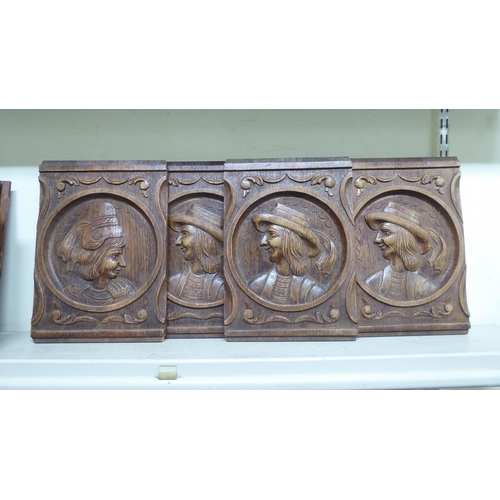 142 - Fourteen early 20thC Continental decoratively carved and turned, stained oak furniture panels: to in... 