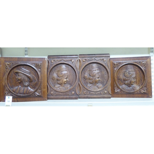 142 - Fourteen early 20thC Continental decoratively carved and turned, stained oak furniture panels: to in... 