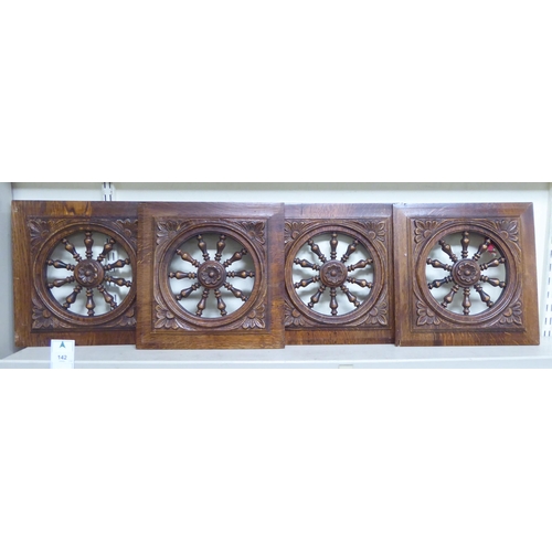 142 - Fourteen early 20thC Continental decoratively carved and turned, stained oak furniture panels: to in... 