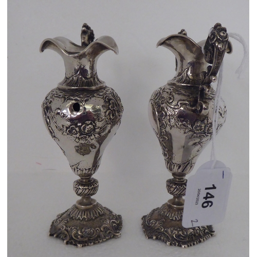 146 - A pair of Continental silver coloured metal miniature, twin handled, ovoid shaped pedestal vases&nbs... 