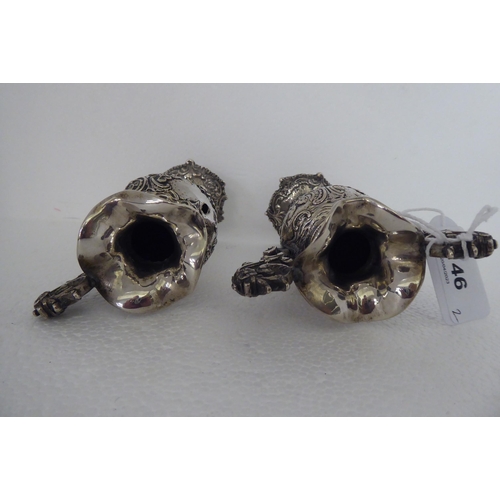 146 - A pair of Continental silver coloured metal miniature, twin handled, ovoid shaped pedestal vases&nbs... 