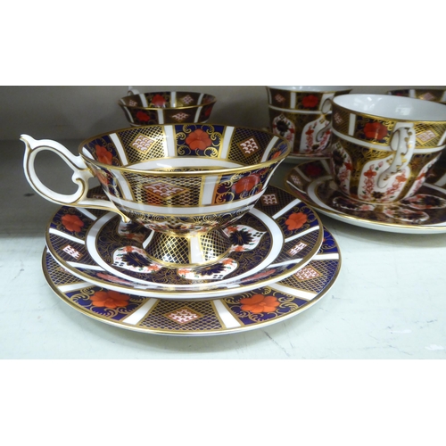 153 - Eight Royal Crown Derby china cups and saucers, decorated in the Imari palette