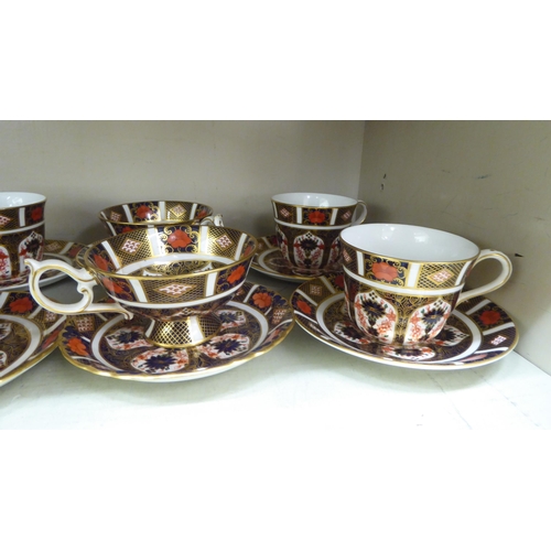 153 - Eight Royal Crown Derby china cups and saucers, decorated in the Imari palette