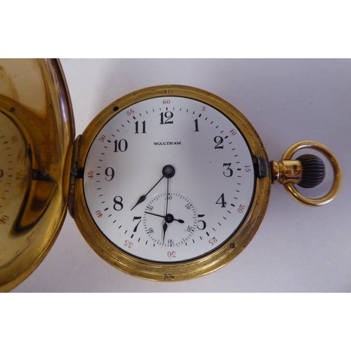 165 - A Waltham 18ct gold cased full hunter pocket watch, the keyless movement faced by a white enamel Ara... 