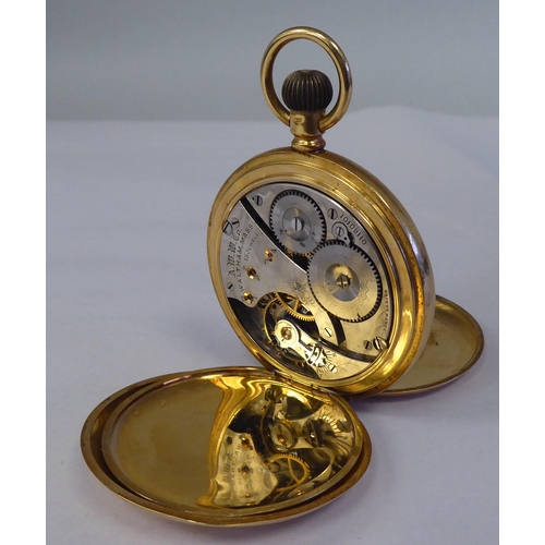 165 - A Waltham 18ct gold cased full hunter pocket watch, the keyless movement faced by a white enamel Ara... 