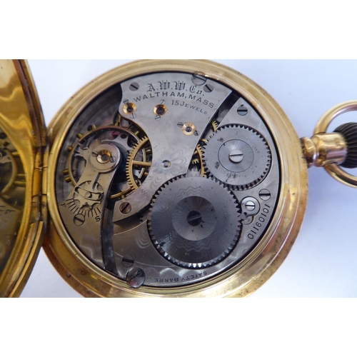 165 - A Waltham 18ct gold cased full hunter pocket watch, the keyless movement faced by a white enamel Ara... 