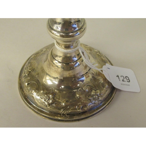 170 - A mid Victorian silver trophy cup of ovoid form, on a knopped pedestal and domed foot, embossed and ... 