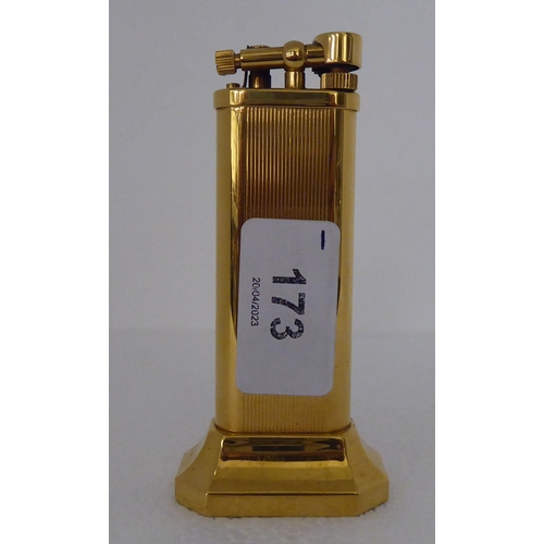 173 - A Dunhill yellow metal cased desk-top, gas filled cigarette lighter  no.21183  4