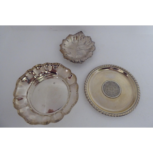 175 - Four various silver dressing table pin dishes  mixed marks; and a silver coloured metal example... 