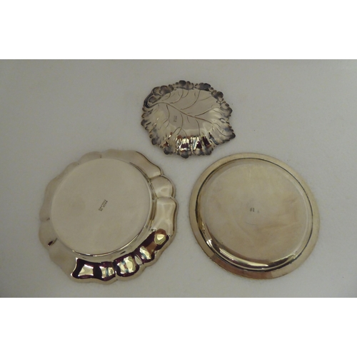 175 - Four various silver dressing table pin dishes  mixed marks; and a silver coloured metal example... 