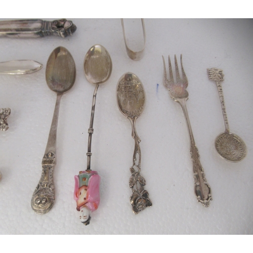 182 - Silver and silver coloured metal items: to include a modern long handled spoon; and three silver han... 