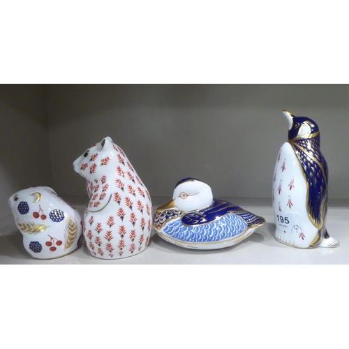 195 - Four Royal Crown Derby china paperweights: to include a penguin  5.5