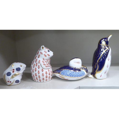 195 - Four Royal Crown Derby china paperweights: to include a penguin  5.5