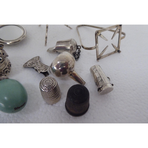 2 - Silver and white metal collectables: to include a whistle  indistinct marks